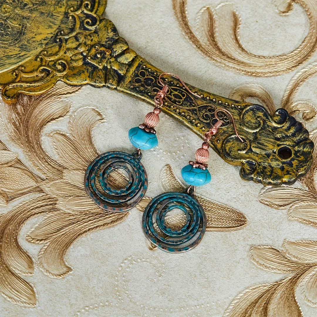 Ité — Copper Patina Circle Earrings